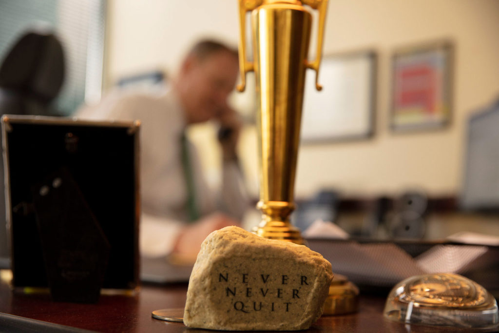 close up of a trophy that says "Never never quit"